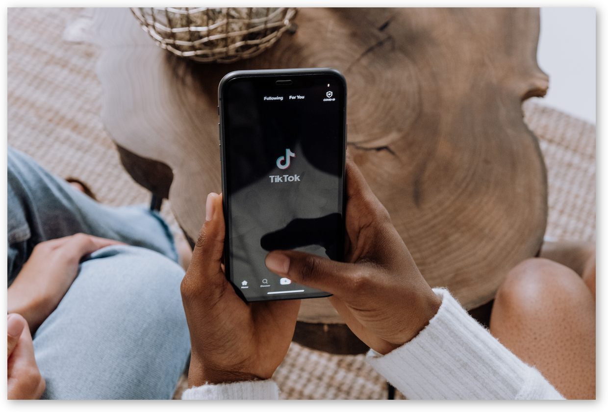 Opening the TikTok app on a smartphone